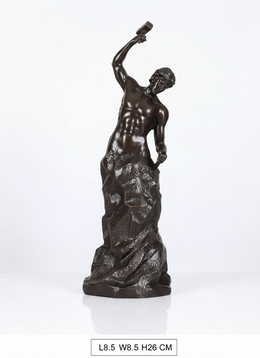 Bronze statue of a figure holding a torch on a white background