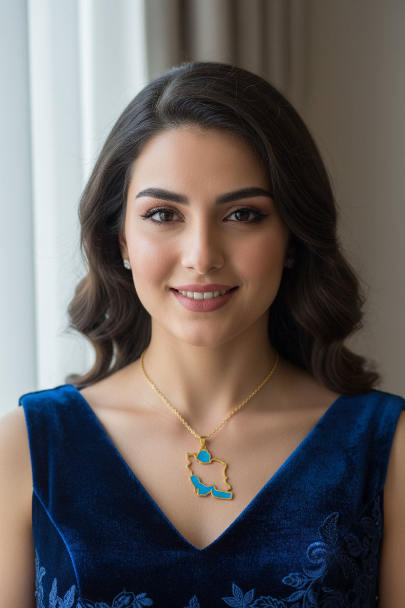 Map-shaped pendant with blue interior and gold outline on a white background