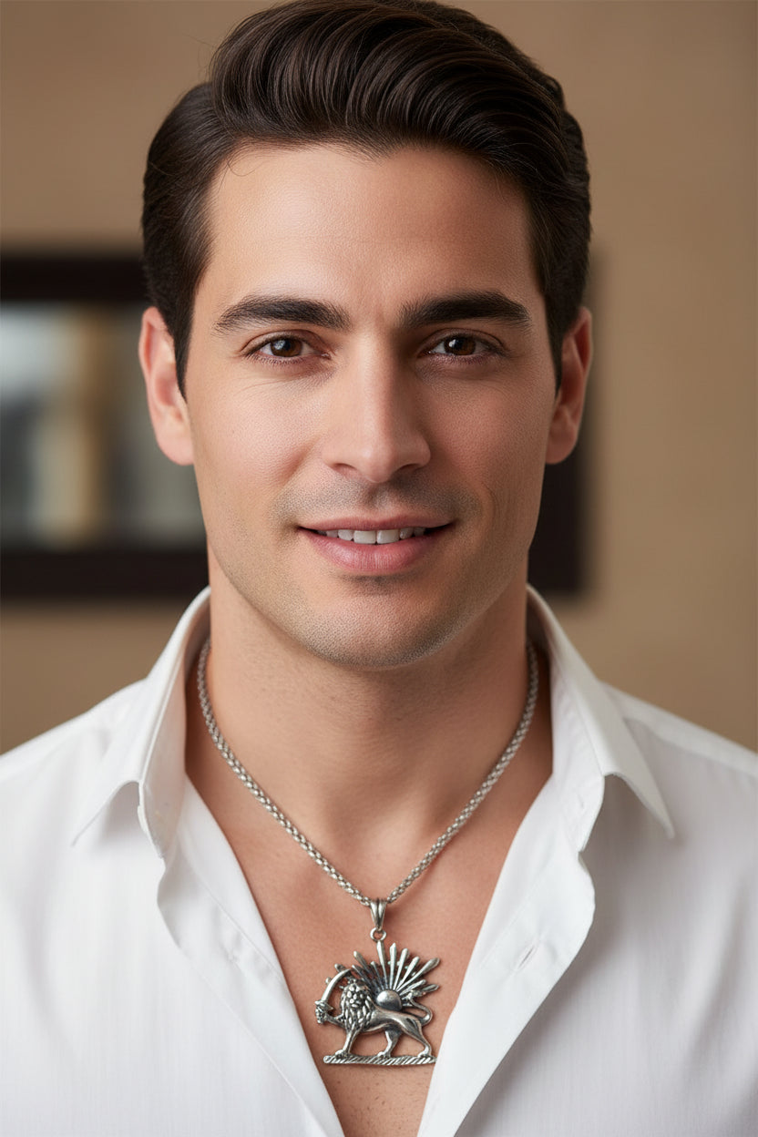 Silver lion pendant with chain on a white background