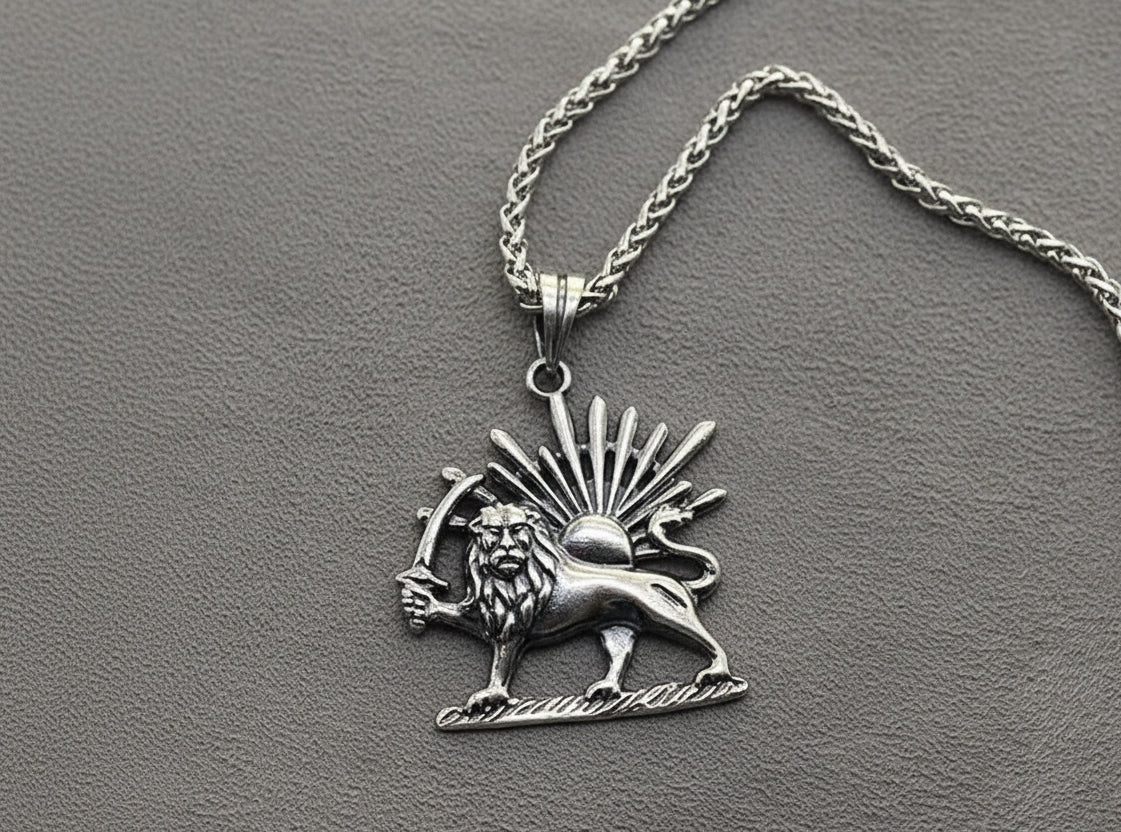 Silver lion pendant necklace on a gray background