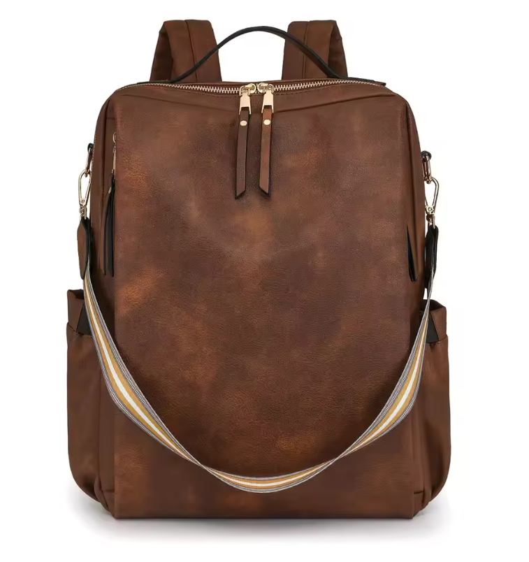 Brown leather backpack with gold zipper on a white background
