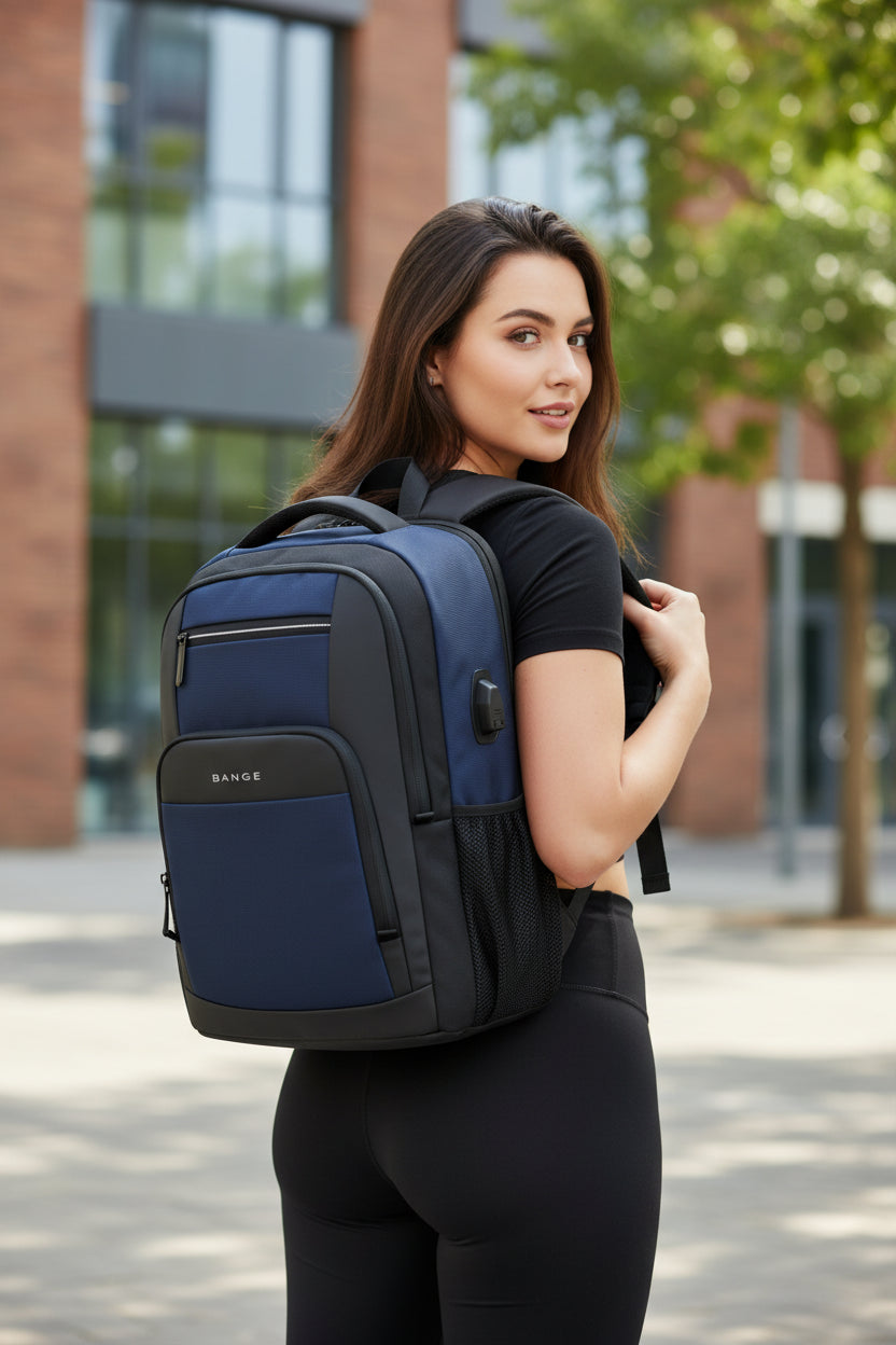 Blue and black backpack with USB port on a white background