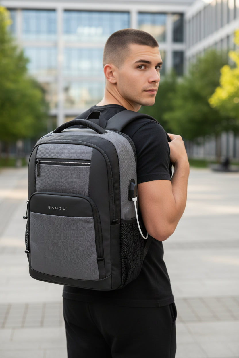 Gray backpack with USB port and smartphone showing charging icon on a white background