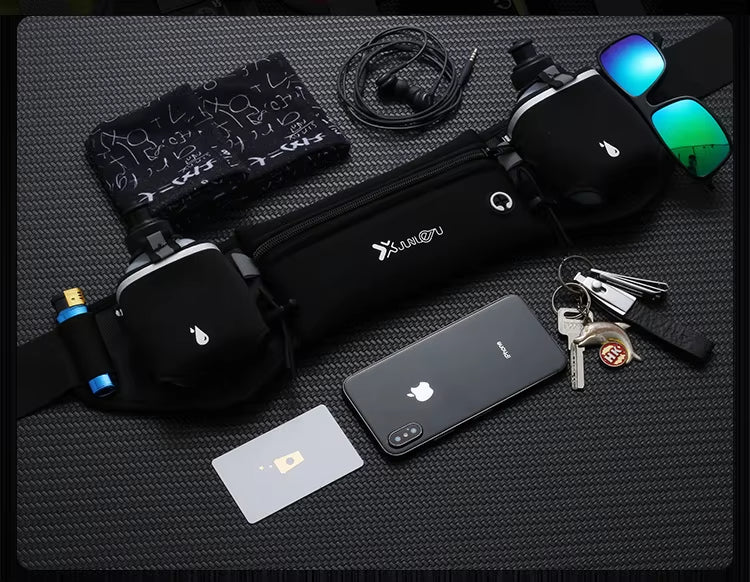 Black waist bag with phone, keys, and other items on a dark textured surface
