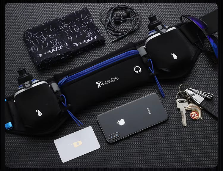 Black waist bag with blue strap, phone, keys, and other items on a textured surface