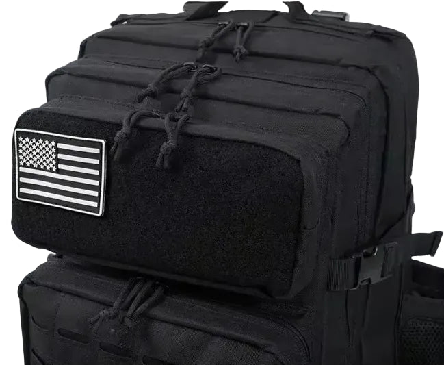 Black tactical backpack with American flag patch on a white background