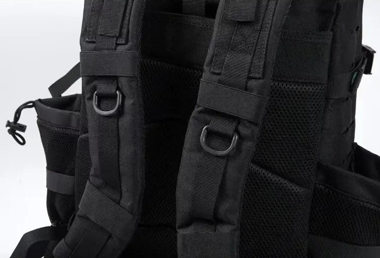 Black tactical backpack with multiple straps and buckles on a white background