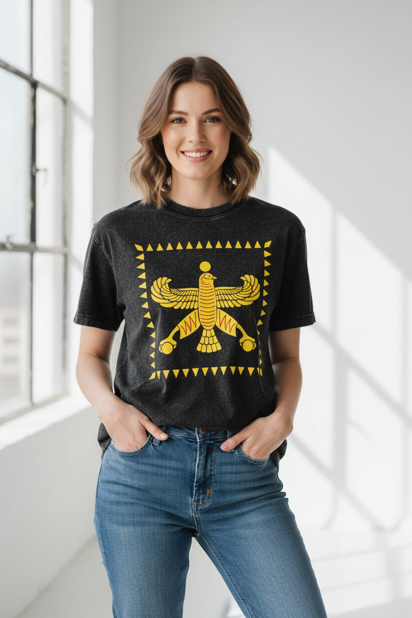 Black t-shirt with yellow winged creature design on a white background