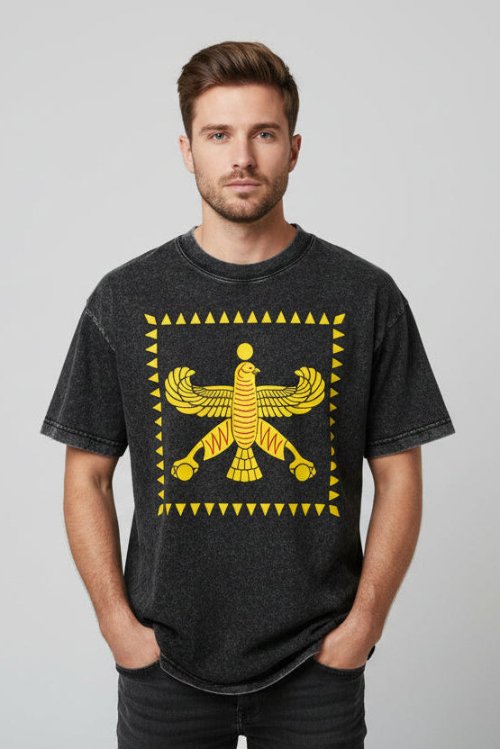 Black t-shirt with yellow winged creature design on a white background